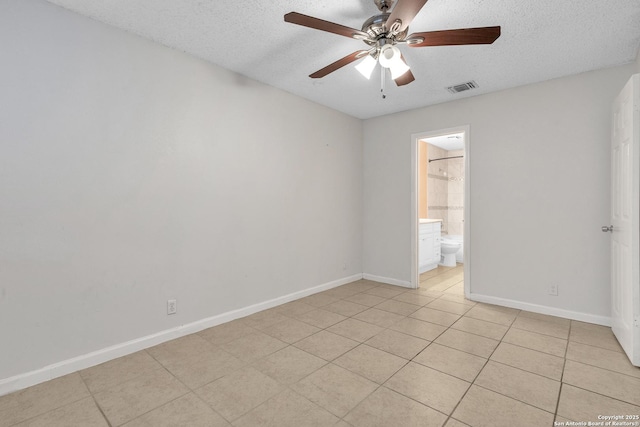 10222 Canton Fld, San Antonio, TX 78245 - spare room featuring a textured ceiling, a ceiling fan, baseboards, and light tile patterned floors
