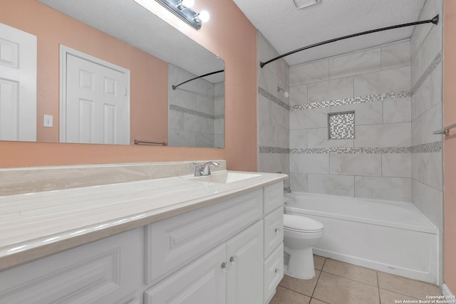 10222 Canton Fld, San Antonio, TX 78245 - full bathroom with vanity, toilet, tile patterned floors, a textured ceiling, and tub / shower combination