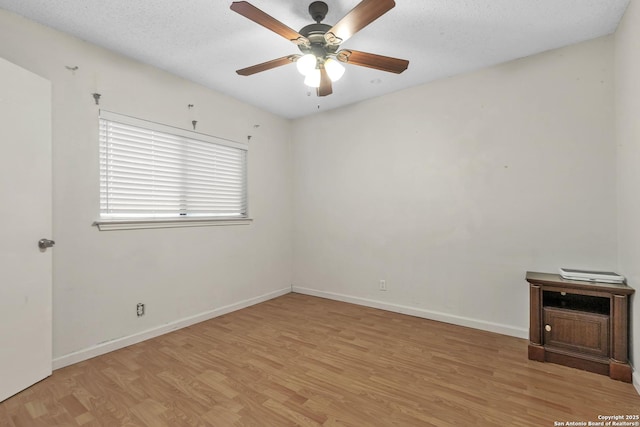 10222 Canton Fld, San Antonio, TX 78245 - spare room featuring light wood-style flooring, a ceiling fan, and baseboards