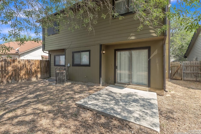 10222 Canton Fld, San Antonio, TX 78245 - back of house with central AC unit and a patio