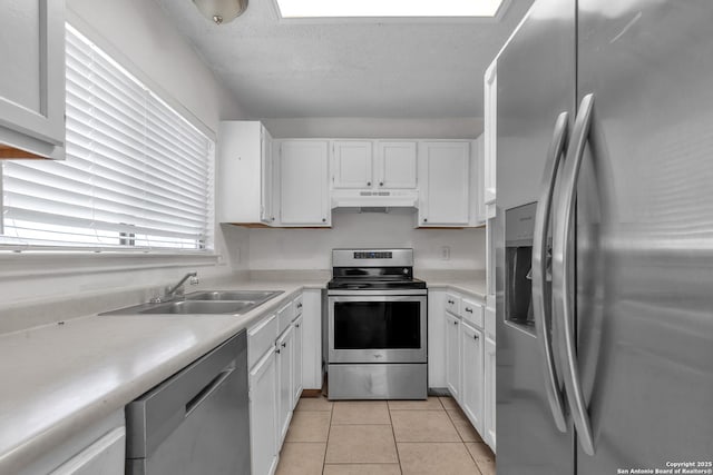 10222 Canton Fld, San Antonio, TX 78245 - kitchen featuring stainless steel appliances, a sink, white cabinets, and a textured ceiling