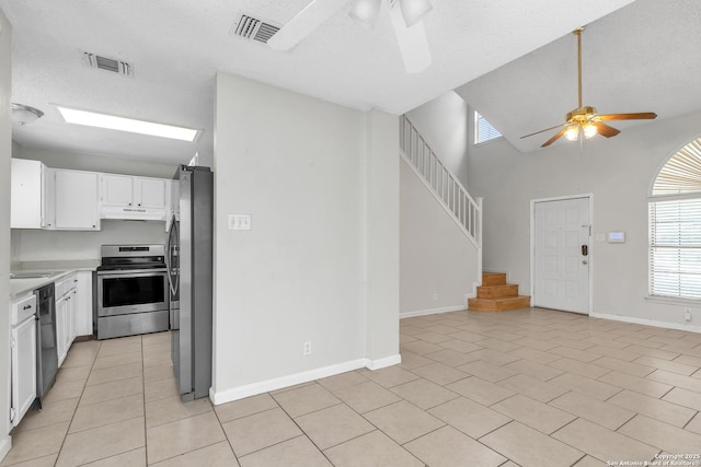 10222 Canton Fld, San Antonio, TX 78245 - kitchen featuring stainless steel appliances, a ceiling fan, under cabinet range hood, light countertops, and white cabinetry