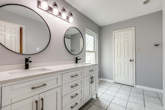 9331 Autumn Sunrise, San Antonio, TX 78254 - full bathroom with double vanity, tile patterned flooring, and baseboards