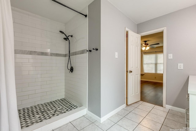 9331 Autumn Sunrise, San Antonio, TX 78254 - bathroom featuring a tile shower, tile patterned flooring, baseboards, and ceiling fan