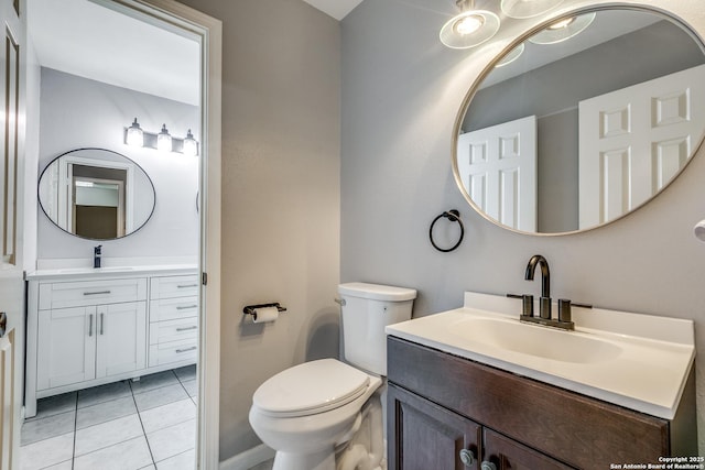 9331 Autumn Sunrise, San Antonio, TX 78254 - bathroom with vanity, tile patterned floors, toilet, and baseboards