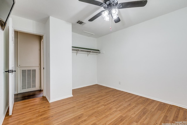 9331 Autumn Sunrise, San Antonio, TX 78254 - unfurnished bedroom with light wood-type flooring, baseboards, a closet, and ceiling fan