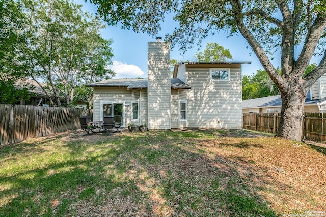 9331 Autumn Sunrise, San Antonio, TX 78254 - rear view of property with a chimney