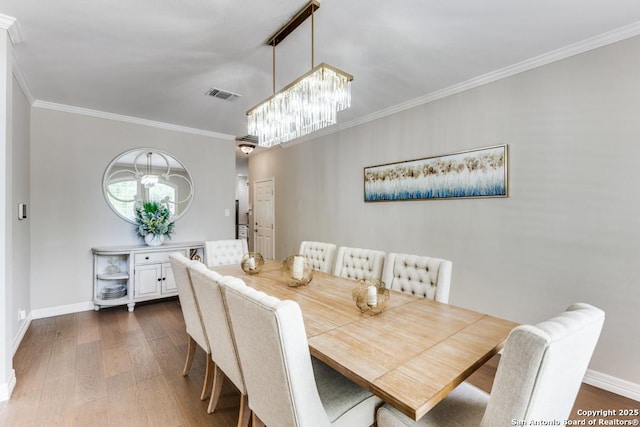 16702 Stones Throw, San Antonio, TX 78248 - dining space with dark wood finished floors, crown molding, a chandelier, and baseboards