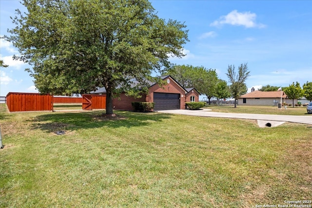 268 Cordova Loop, Seguin, TX 78155 - view of yard with driveway and a garage