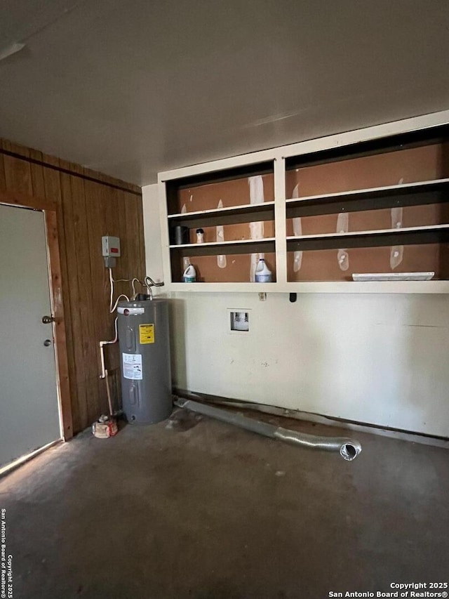 809 Marilyn, Schertz, TX 78154 - garage featuring water heater and wood walls