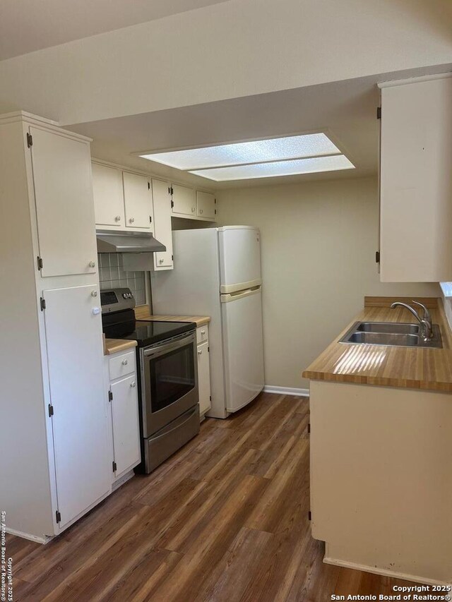 809 Marilyn, Schertz, TX 78154 - kitchen with stainless steel range with electric cooktop, a sink, dark wood finished floors, under cabinet range hood, and white cabinetry