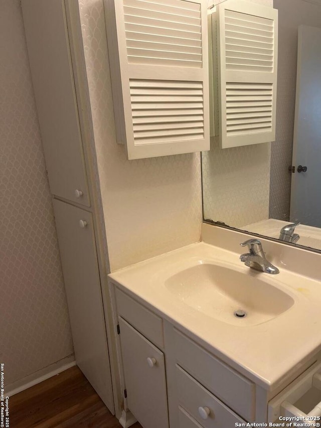 809 Marilyn, Schertz, TX 78154 - bathroom featuring vanity, wood finished floors, and wallpapered walls
