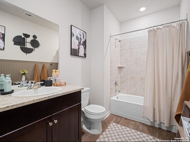 6416 Embankment, San Antonio, TX 78252 - bathroom with toilet, vanity, wood finished floors, and shower / bath combination with curtain