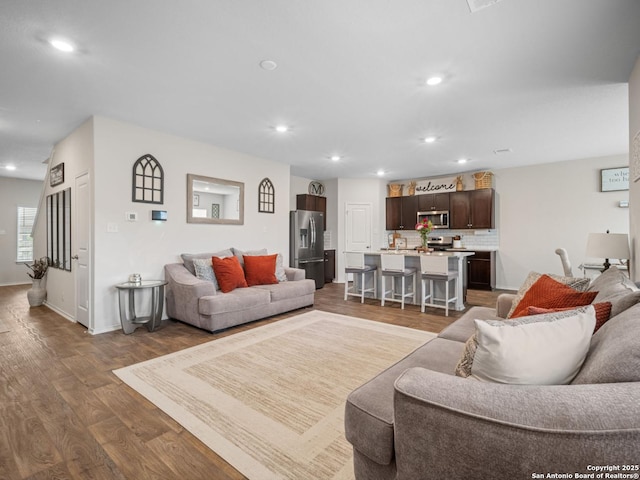 6416 Embankment, San Antonio, TX 78252 - living room with recessed lighting, dark wood-style flooring, and baseboards
