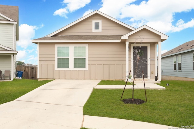 1206 Kiskadee Way, San Antonio, TX 78245 - view of front of home featuring a shingled roof, board and batten siding, and driveway