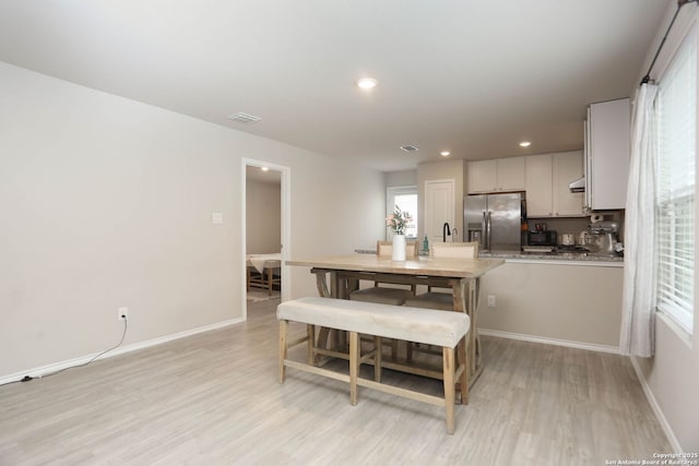 1206 Kiskadee Way, San Antonio, TX 78245 - dining room featuring light wood-type flooring, baseboards, and recessed lighting