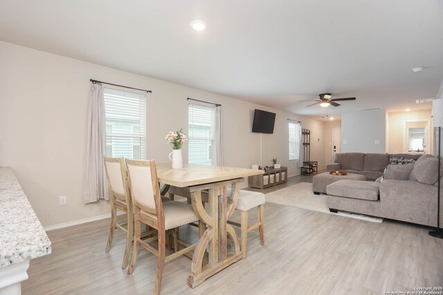 1206 Kiskadee Way, San Antonio, TX 78245 - dining area featuring light wood finished floors, ceiling fan, baseboards, and recessed lighting