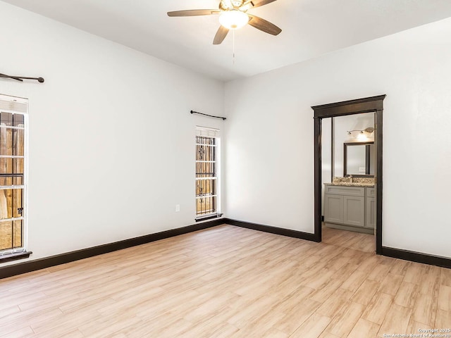 3601 Candleridge, San Antonio, TX 78244 - spare room featuring ceiling fan, light wood-style floors, baseboards, and a sink