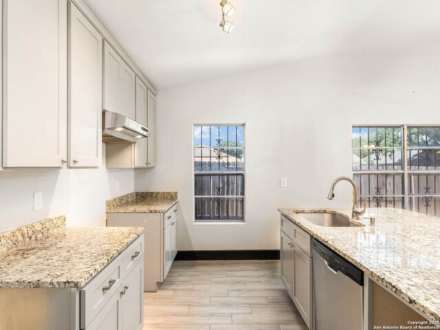 3601 Candleridge, San Antonio, TX 78244 - kitchen with dishwasher, a sink, under cabinet range hood, healthy amount of natural light, and lofted ceiling