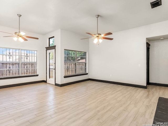 3601 Candleridge, San Antonio, TX 78244 - unfurnished living room with ceiling fan, wood finished floors, and baseboards