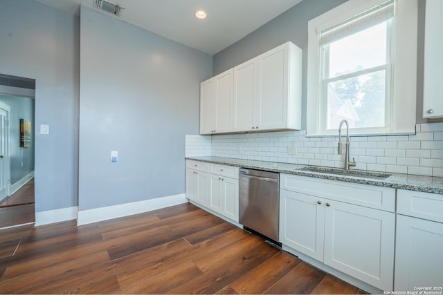 2007 S Presa, San Antonio, TX 78210 - kitchen with dishwasher, a sink, light stone countertops, dark wood-style flooring, and white cabinetry