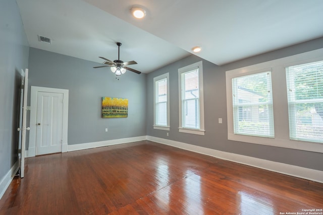 2007 S Presa, San Antonio, TX 78210 - empty room featuring baseboards, dark wood-style floors, ceiling fan, plenty of natural light, and lofted ceiling