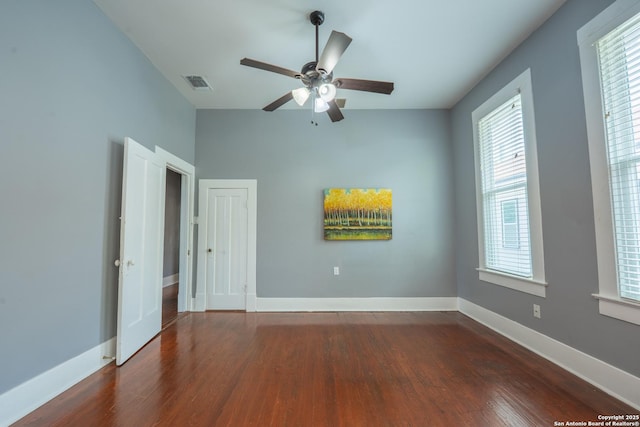 2007 S Presa, San Antonio, TX 78210 - empty room featuring dark wood-style flooring, ceiling fan, and baseboards