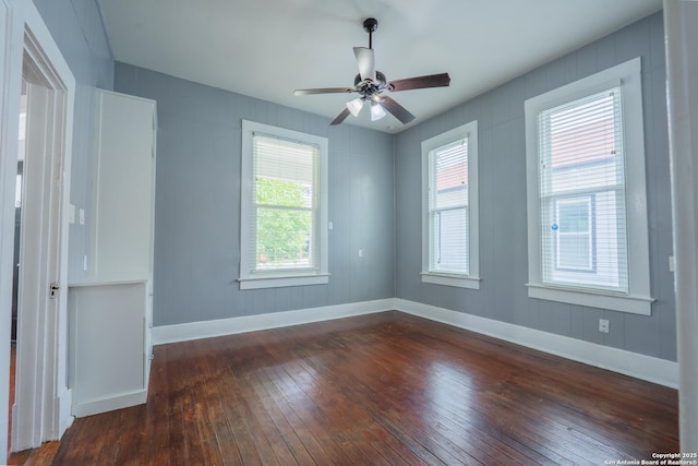 2007 S Presa, San Antonio, TX 78210 - unfurnished room with dark wood-type flooring, healthy amount of natural light, ceiling fan, and baseboards