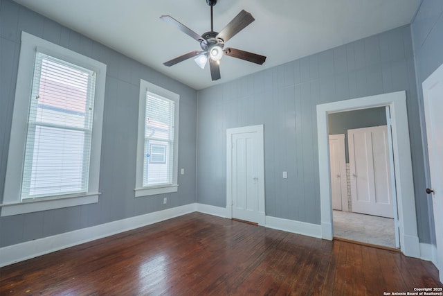 2007 S Presa, San Antonio, TX 78210 - unfurnished bedroom with wood-type flooring, baseboards, and a ceiling fan