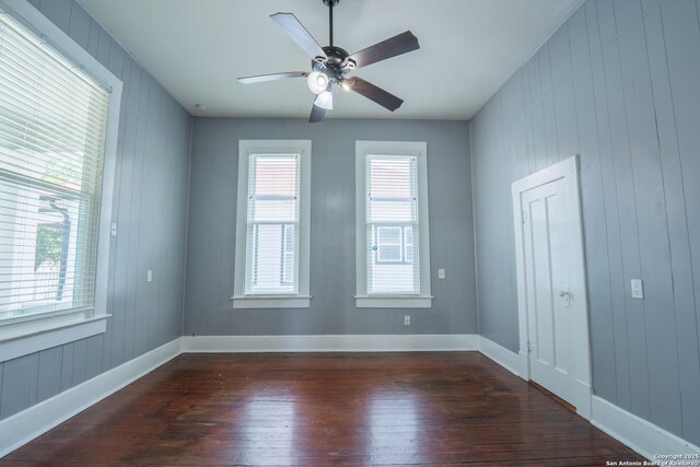 2007 S Presa, San Antonio, TX 78210 - empty room featuring dark wood-type flooring, a ceiling fan, and baseboards