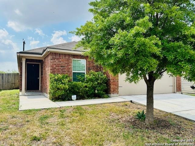 15134 Silver Tree, Von Ormy, TX 78073 - view of front of home with brick siding and concrete driveway