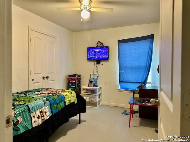 15134 Silver Tree, Von Ormy, TX 78073 - carpeted bedroom with a ceiling fan and baseboards
