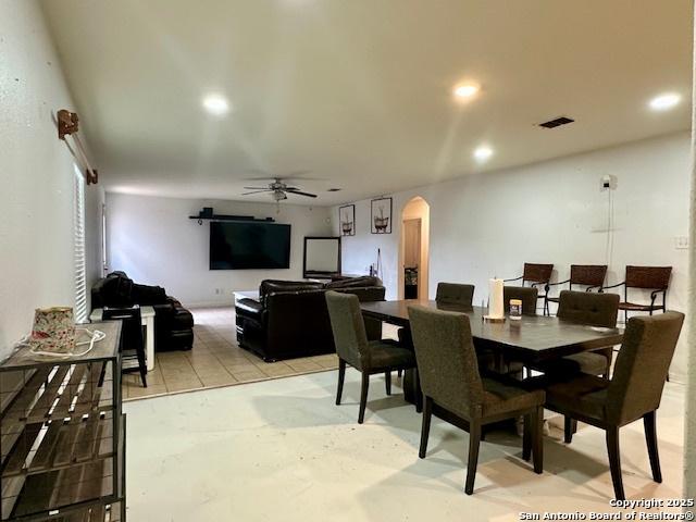 15134 Silver Tree, Von Ormy, TX 78073 - dining area with arched walkways, ceiling fan, and recessed lighting