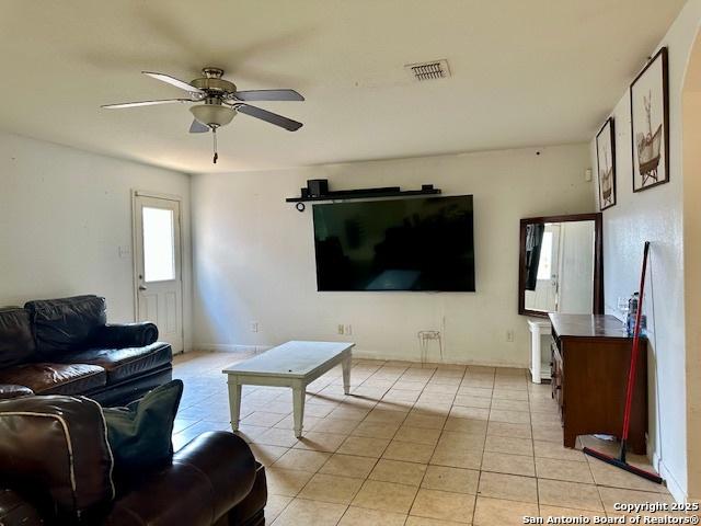 15134 Silver Tree, Von Ormy, TX 78073 - living room featuring ceiling fan and light tile patterned flooring