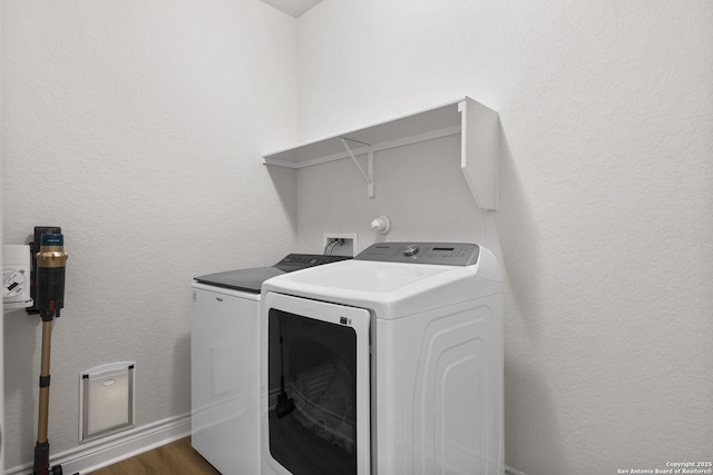7618 Desperado, Boerne, TX 78015 - washroom featuring washing machine and dryer, dark wood finished floors, and baseboards