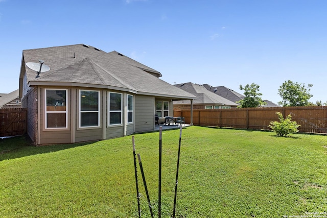 7618 Desperado, Boerne, TX 78015 - rear view of house featuring a shingled roof and a patio