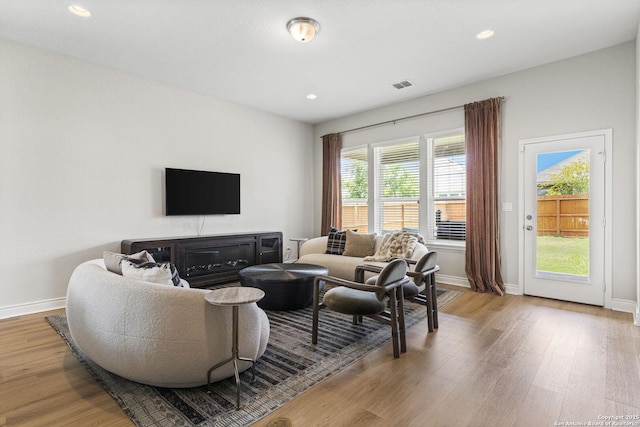 7618 Desperado, Boerne, TX 78015 - living room with light wood-style floors, baseboards, and recessed lighting