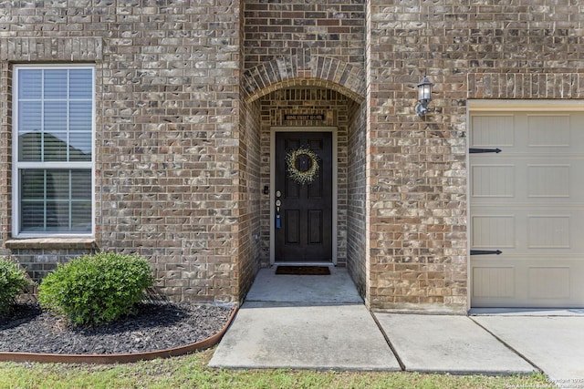 7618 Desperado, Boerne, TX 78015 - property entrance featuring brick siding and a garage