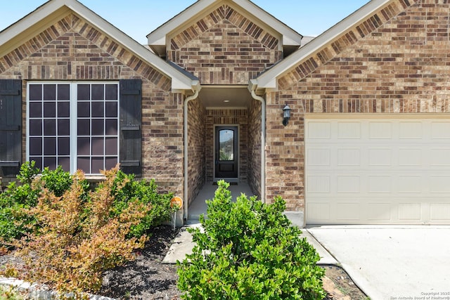 122 Braeburn, Boerne, TX 78015 - property entrance featuring a garage and brick siding