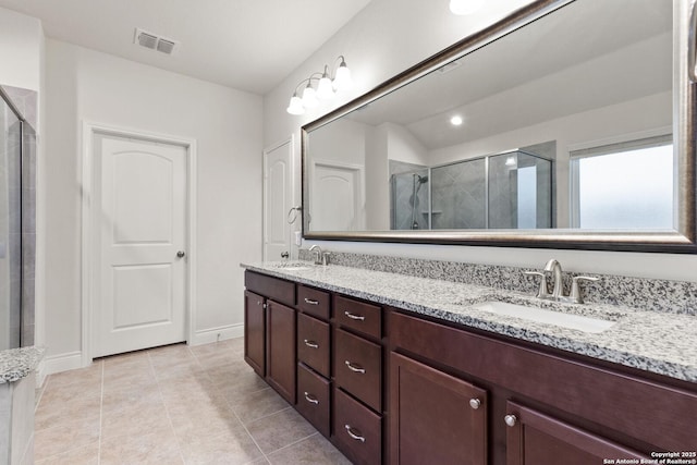 122 Braeburn, Boerne, TX 78015 - full bath with a stall shower, double vanity, tile patterned floors, and baseboards