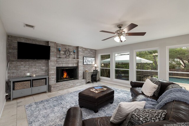 611 San Diego, San Antonio, TX 78232 - living area featuring a brick fireplace and a ceiling fan