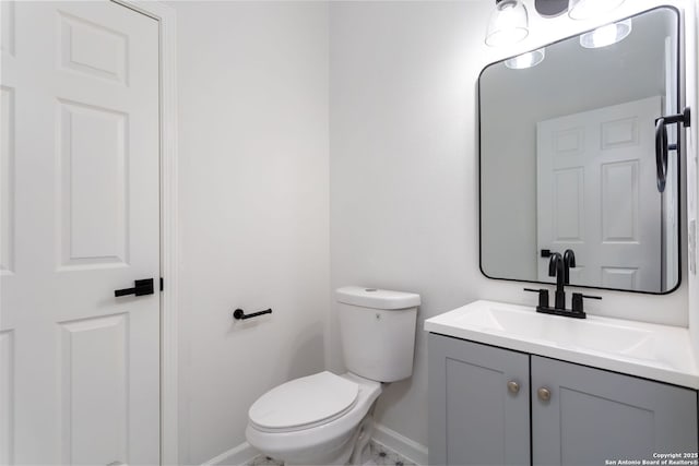 155 Vine St, San Antonio, TX 78210 - bathroom with vanity, baseboards, and toilet