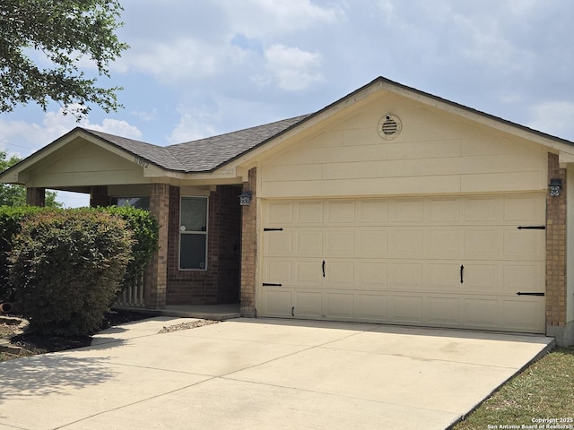 11002 Colt Chase, San Antonio, TX 78254 - ranch-style home with roof with shingles, brick siding, an attached garage, and concrete driveway