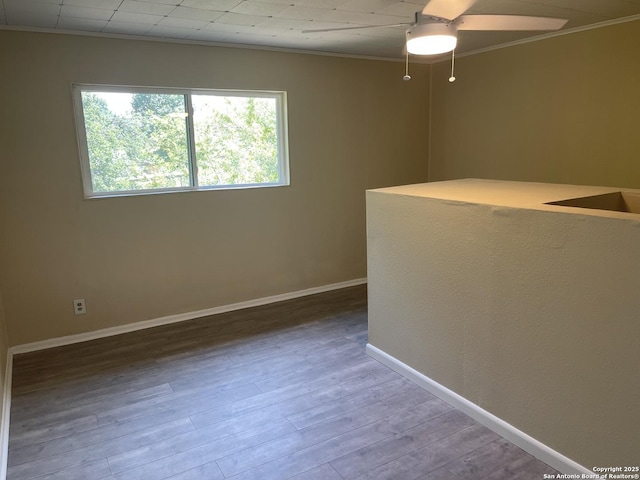 1538 Thorain, San Antonio, TX 78201 - empty room featuring ornamental molding, ceiling fan, wood finished floors, and baseboards