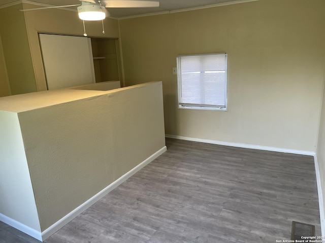 1538 Thorain, San Antonio, TX 78201 - unfurnished room with wood finished floors, baseboards, a ceiling fan, and ornamental molding