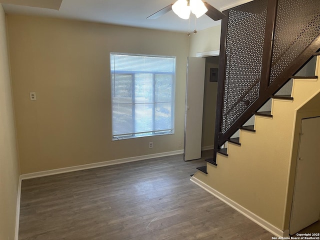 1538 Thorain, San Antonio, TX 78201 - stairway featuring ceiling fan, wood finished floors, and baseboards