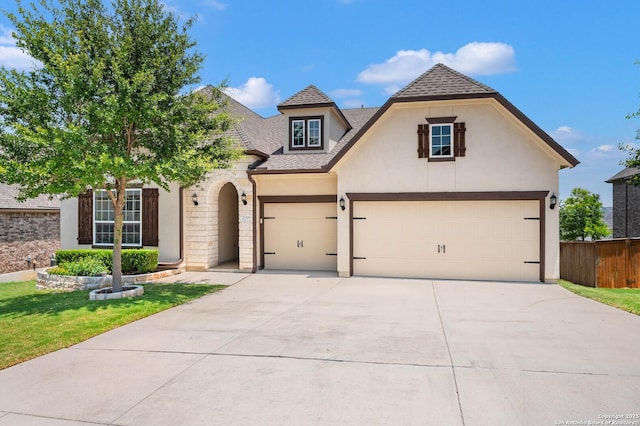 25318 Pleasant Bch, San Antonio, TX 78255 - french country home with driveway, stucco siding, roof with shingles, and stone siding