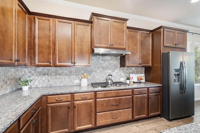 25318 Pleasant Bch, San Antonio, TX 78255 - kitchen featuring stainless steel appliances, under cabinet range hood, decorative backsplash, crown molding, and light stone counters