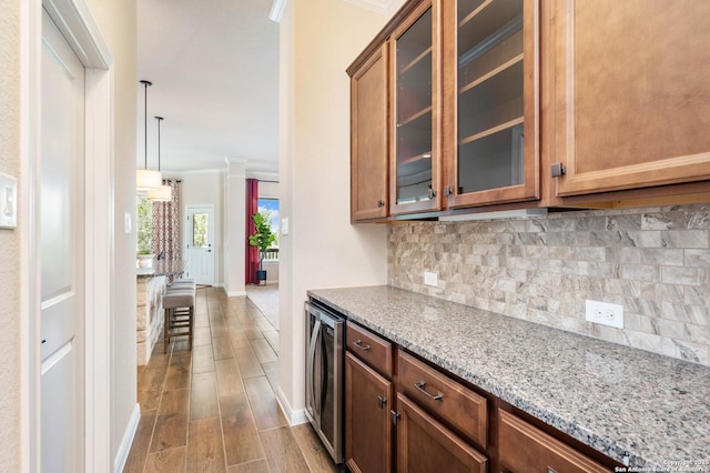 25318 Pleasant Bch, San Antonio, TX 78255 - kitchen featuring wine cooler, crown molding, tasteful backsplash, baseboards, and light stone countertops