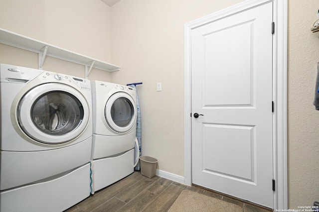 25318 Pleasant Bch, San Antonio, TX 78255 - laundry room with dark wood-style floors, separate washer and dryer, and baseboards